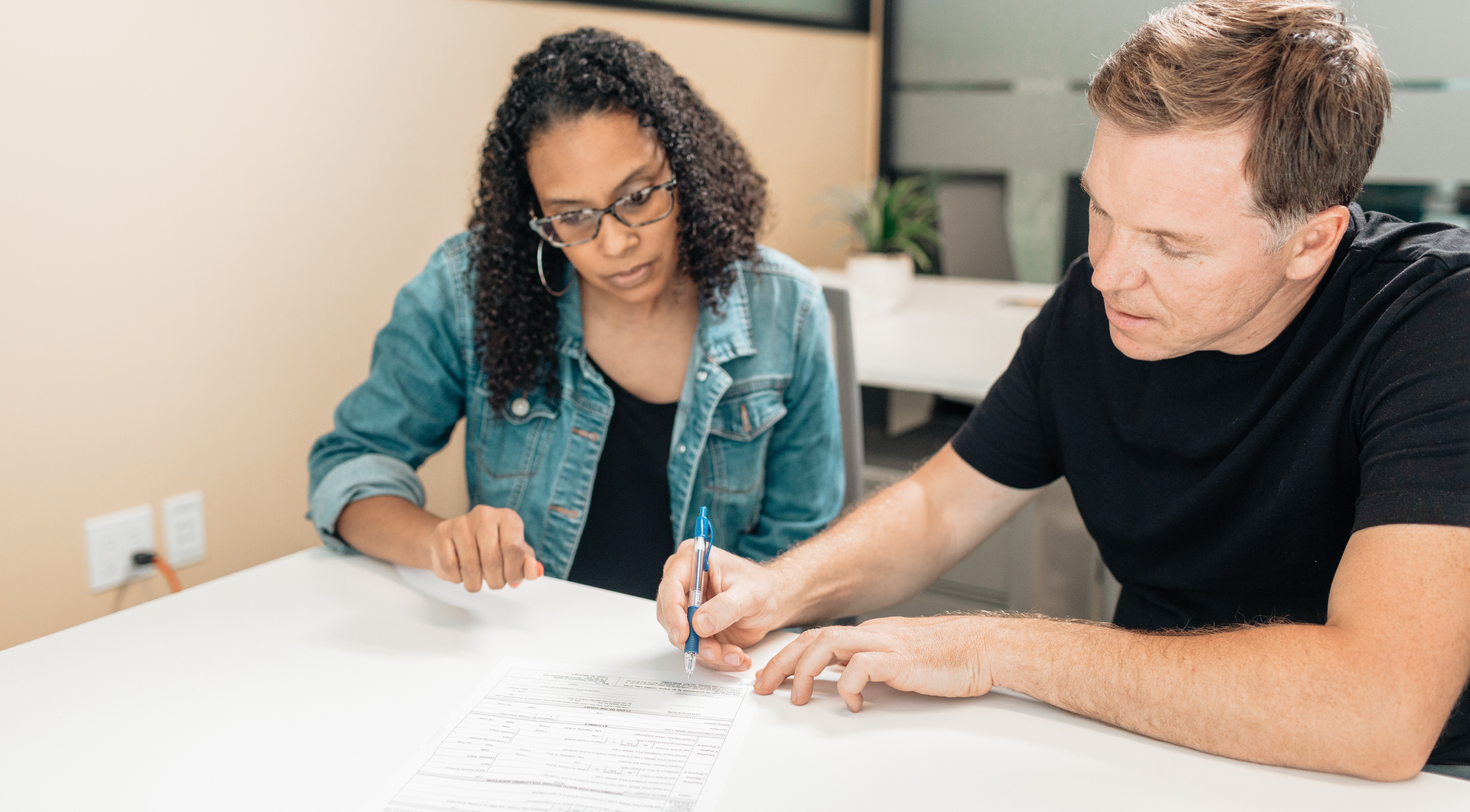 man and woman in a meeting
