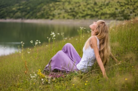woman sitting on grass